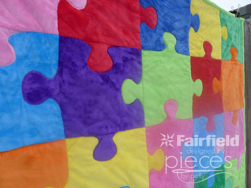 Pieces by polly puzzle quilt with cuddle fabric